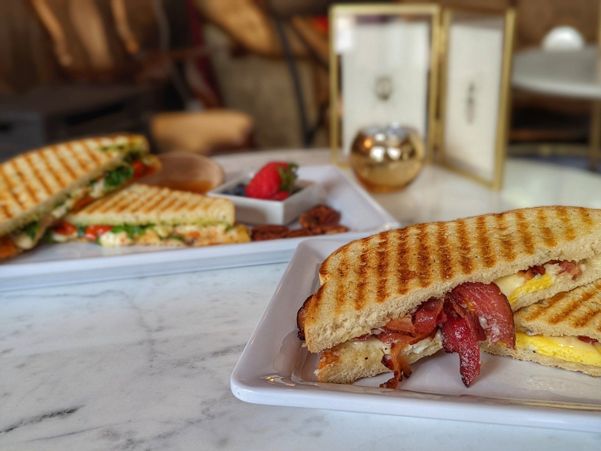 A close up of a sandwich on a plate on a table.