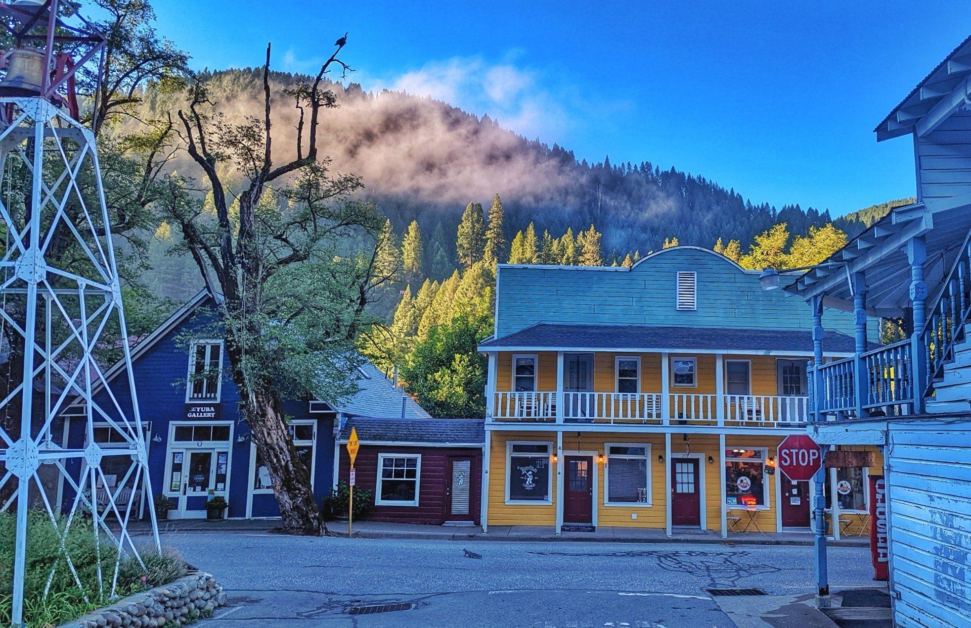 A yellow building with a stop sign in front of it