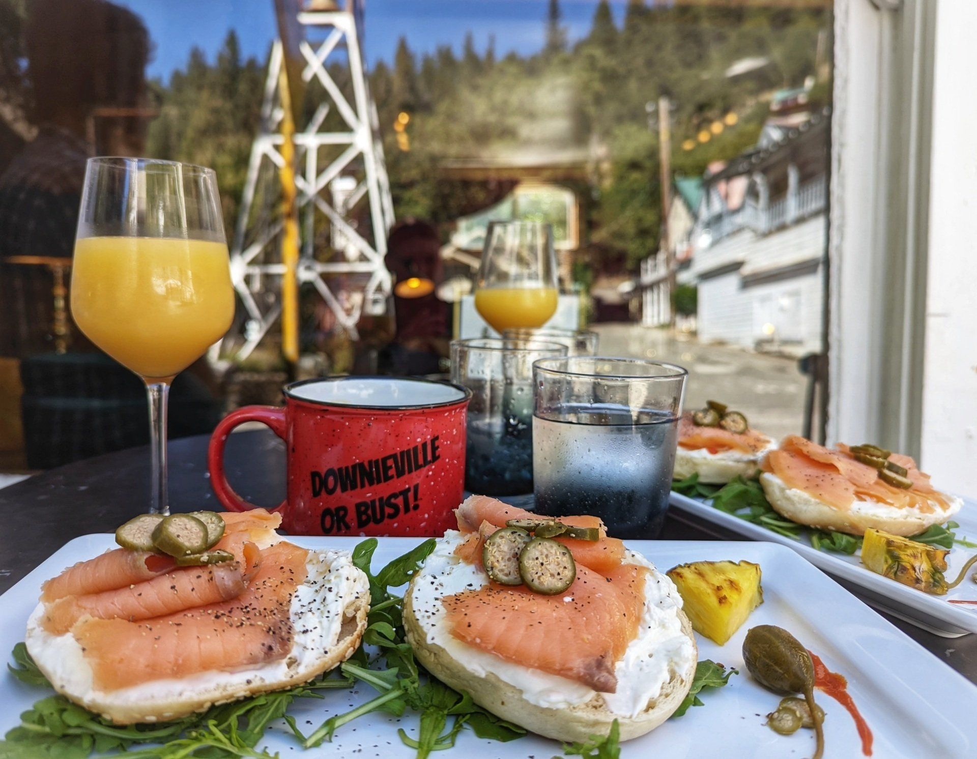A plate of food with a cup that says downeyville on it