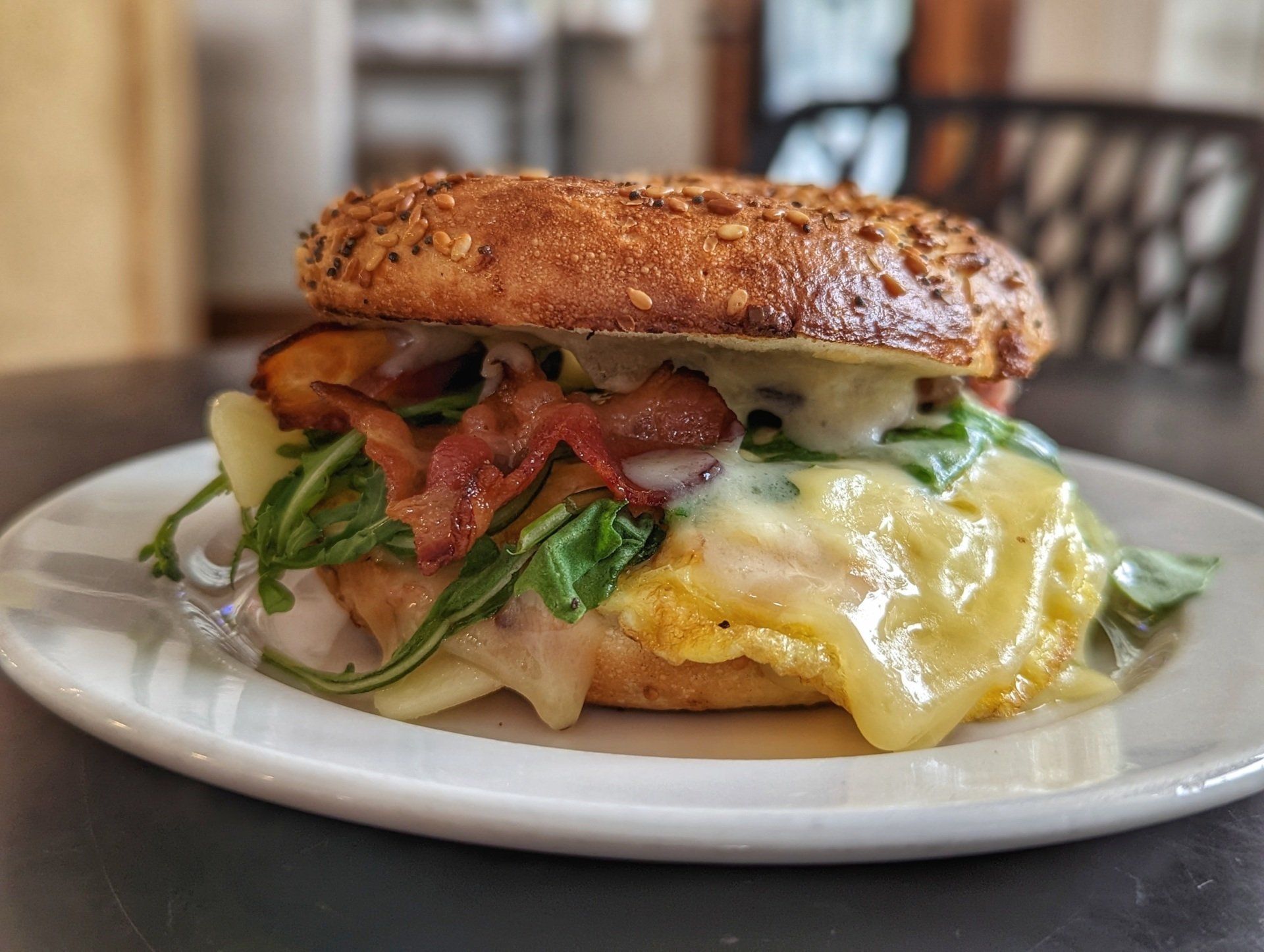 A close up of a sandwich on a plate on a table.