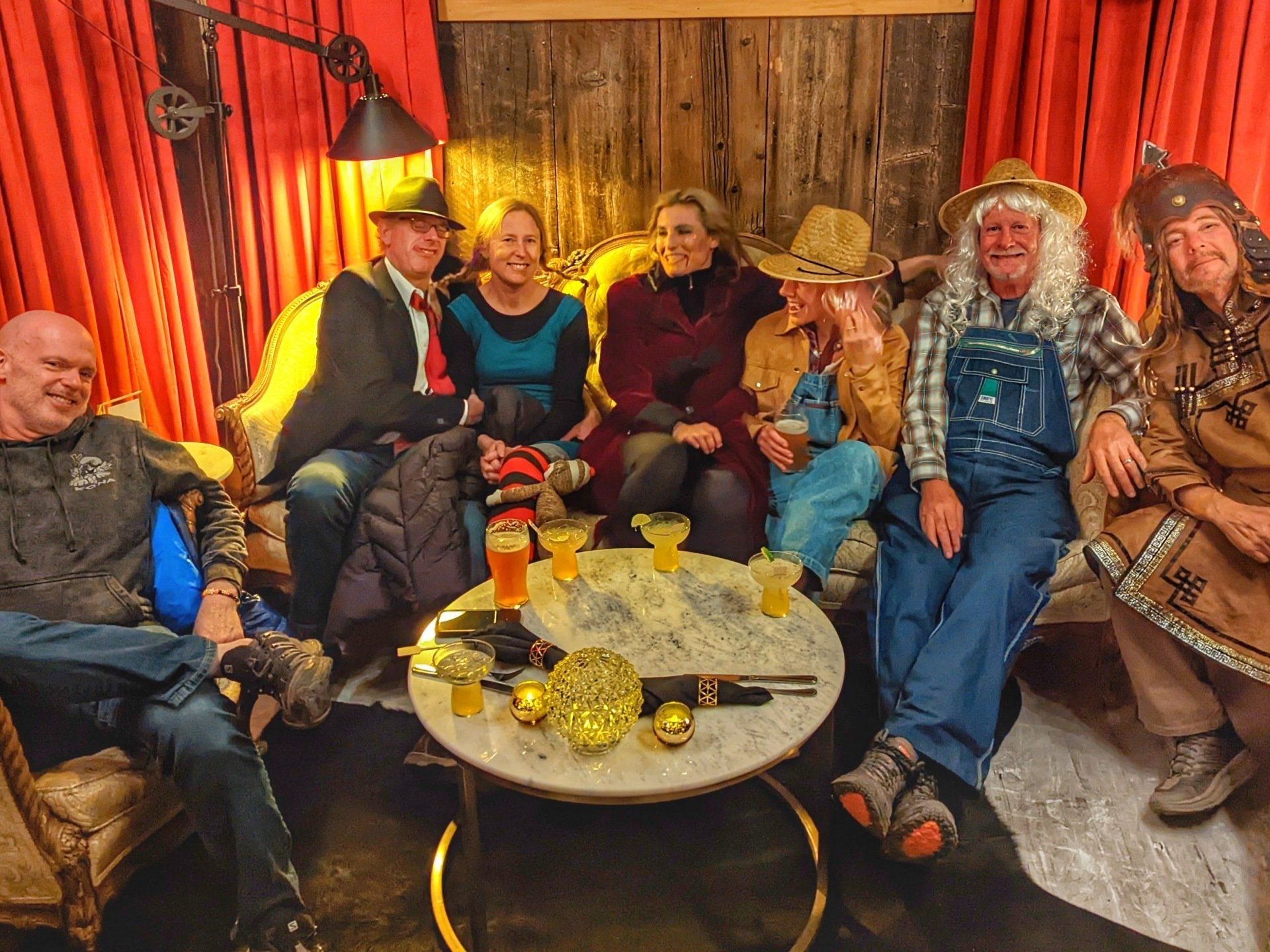 A group of people are sitting around a table in a room.