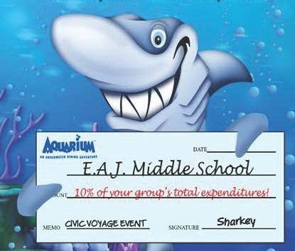 A shark is holding a check for e.a.j. middle school