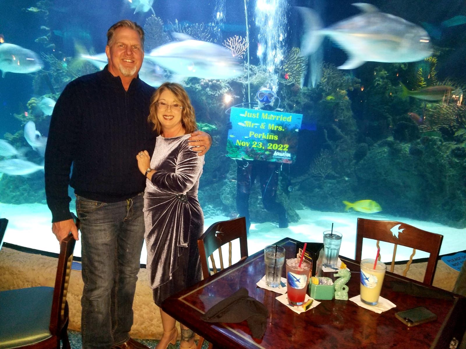 just married dive sign with couple