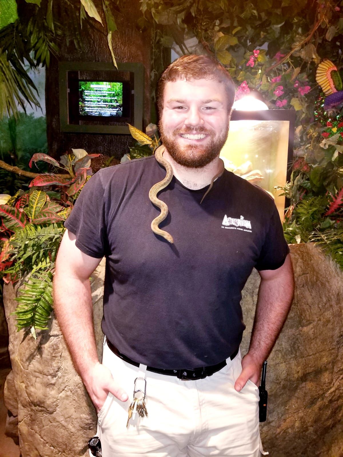 A man holding a snake