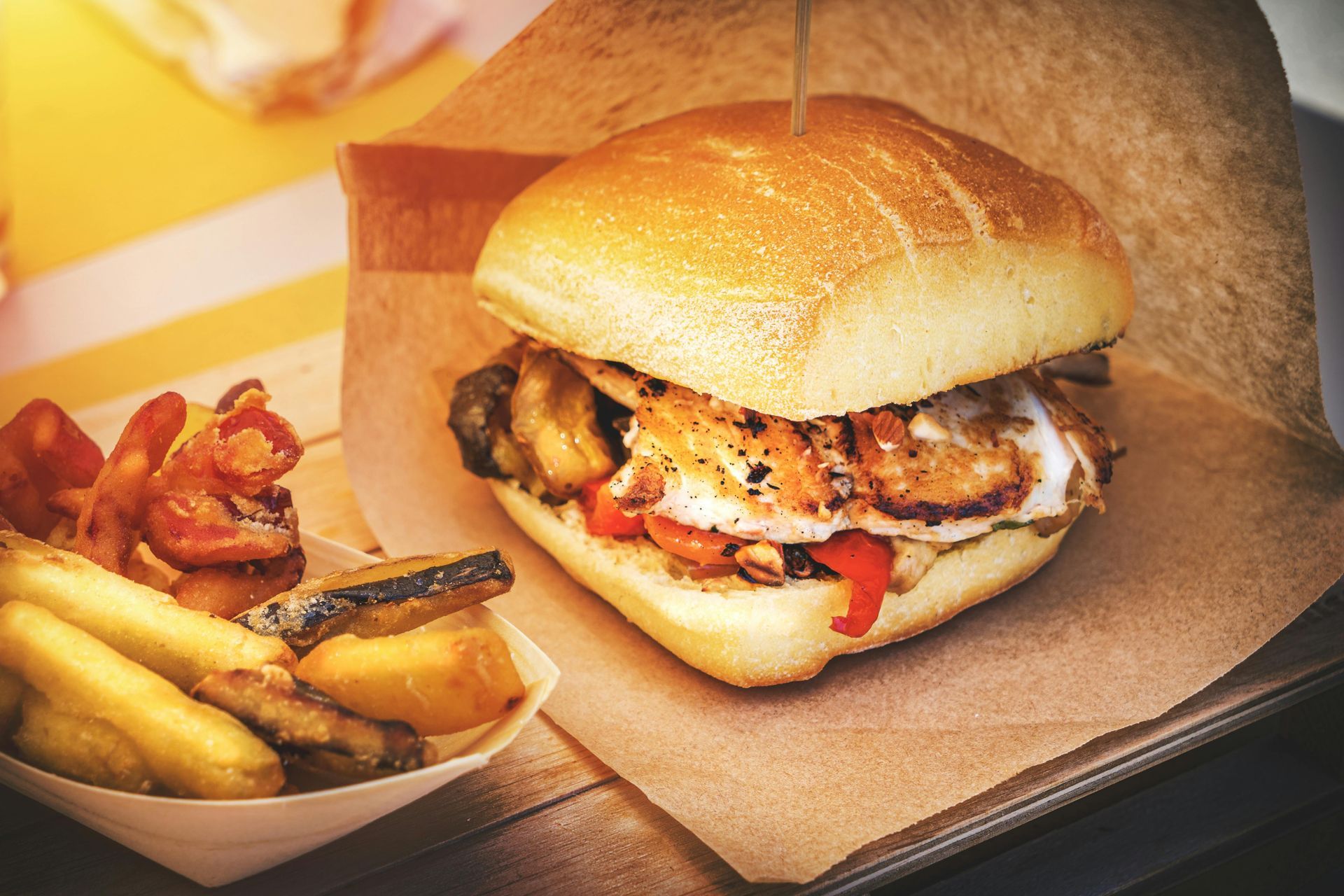 A sandwich and french fries are on a table