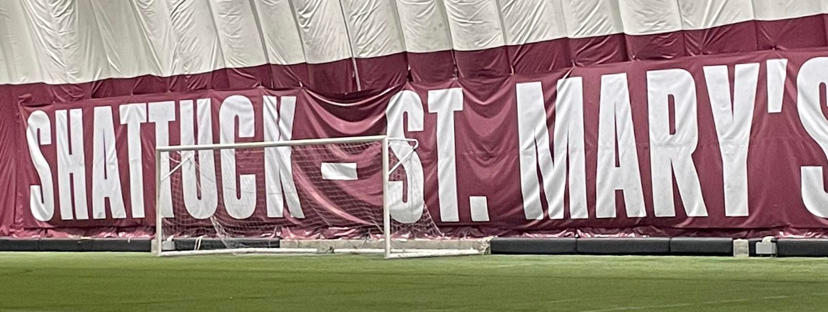 A maroon banner with 