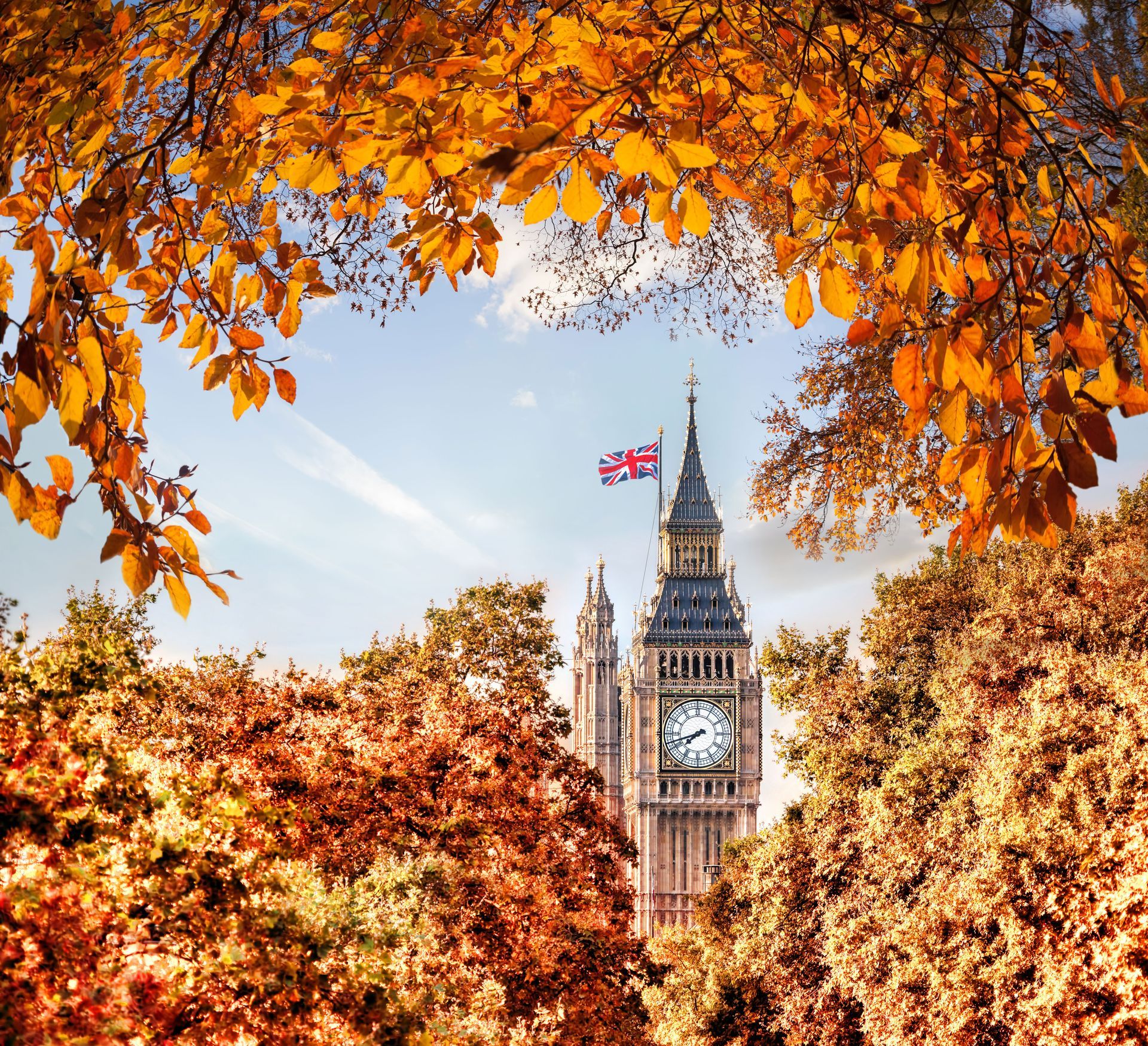 The Elizabeth Tower (Big Ben) and Parliament, visible through autumn trees on the Embankment