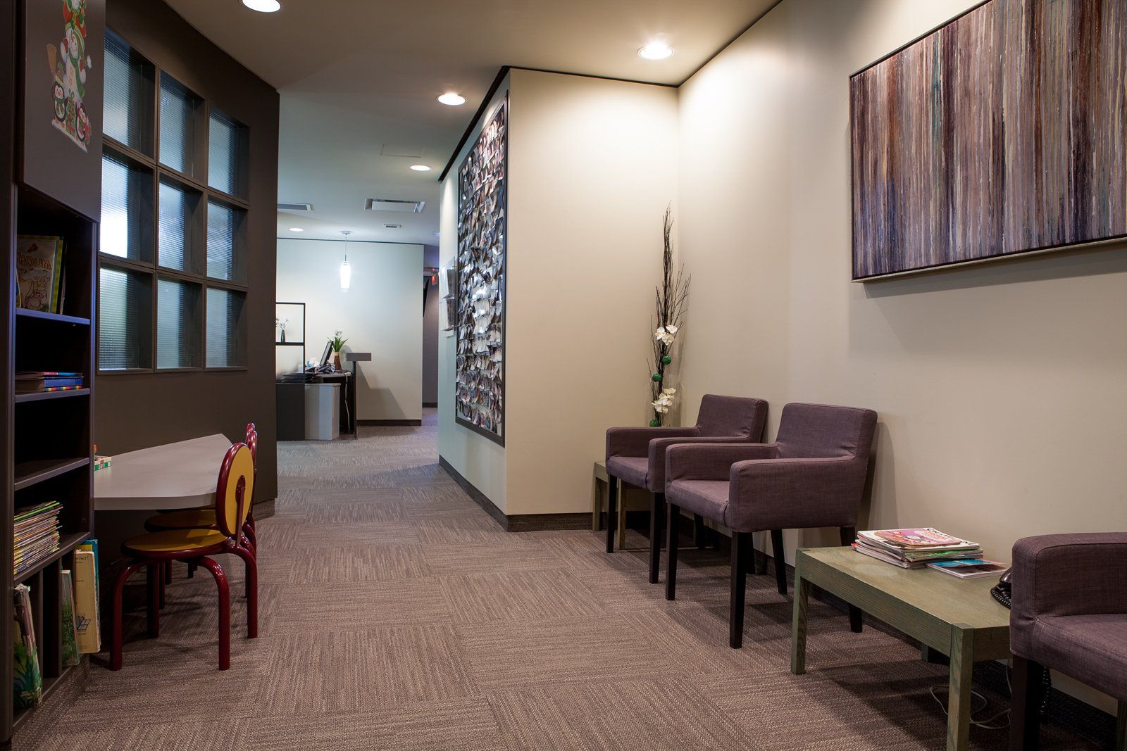 dentist office with violet waiting chairs