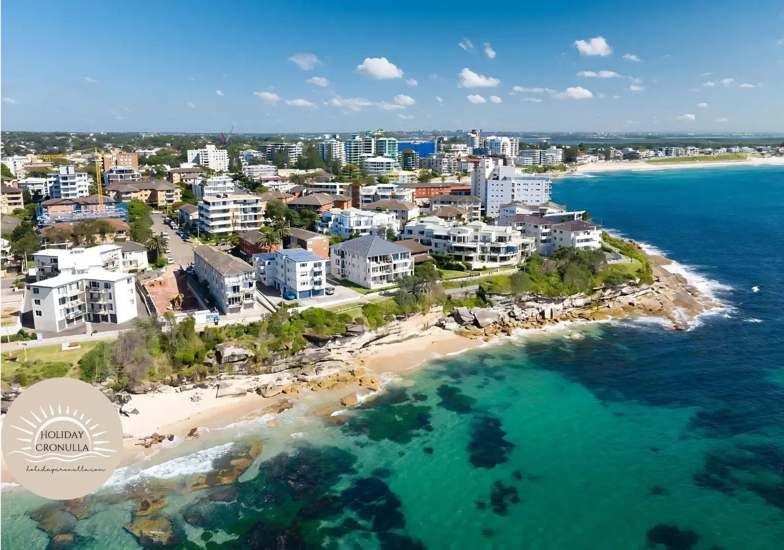 An aerial view of a city next to the ocean