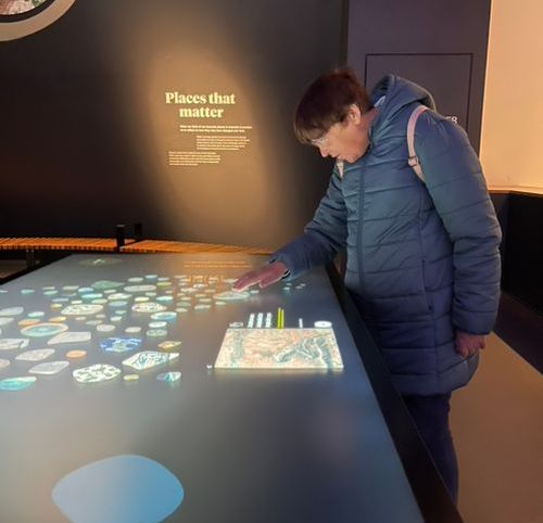 A person is looking at a screen that says places that matter