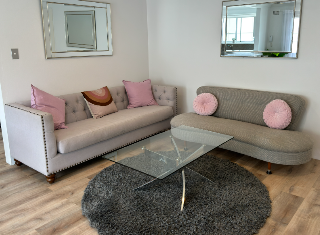 A living room with two couches and a coffee table