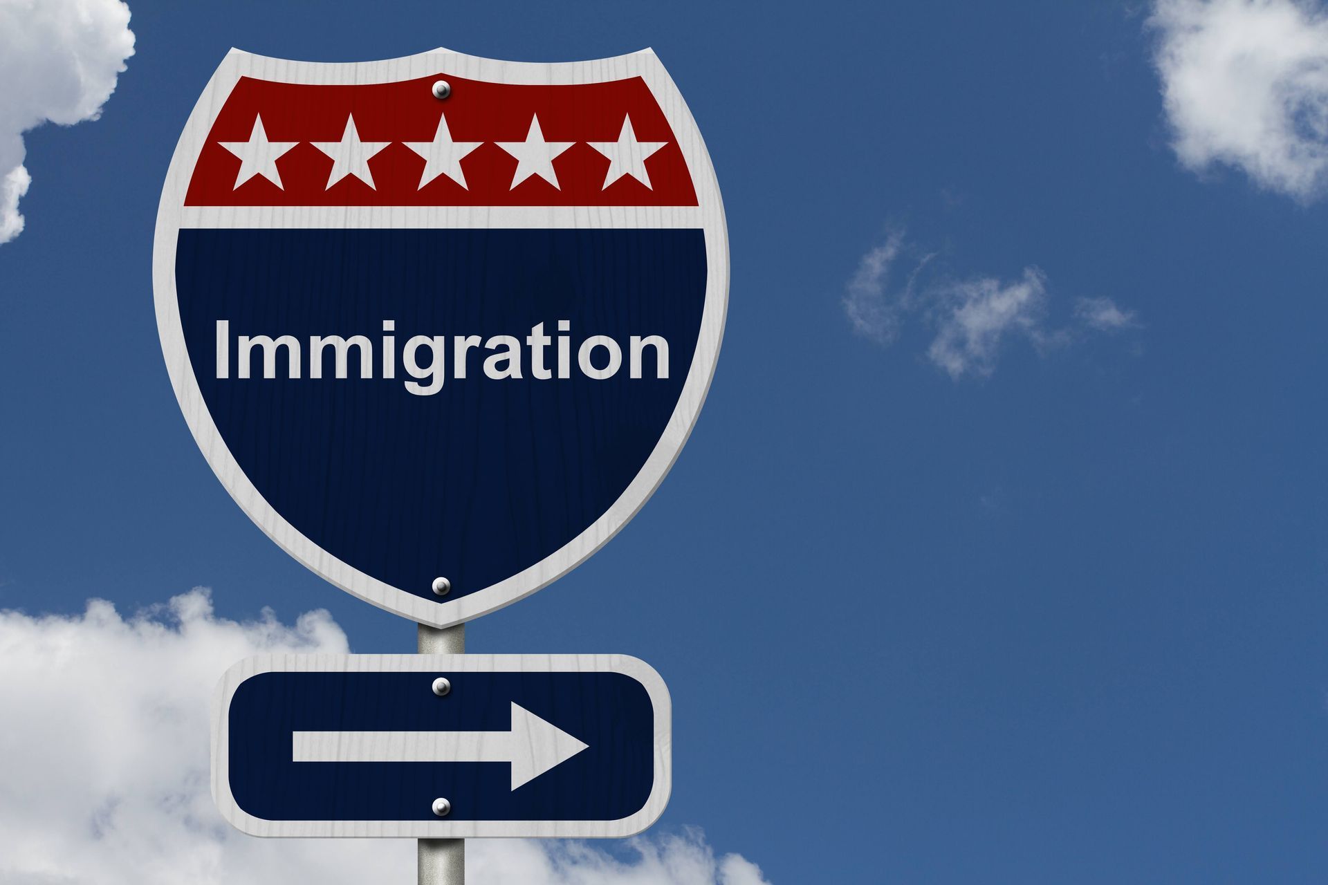 A highway sign with the word immigration on it