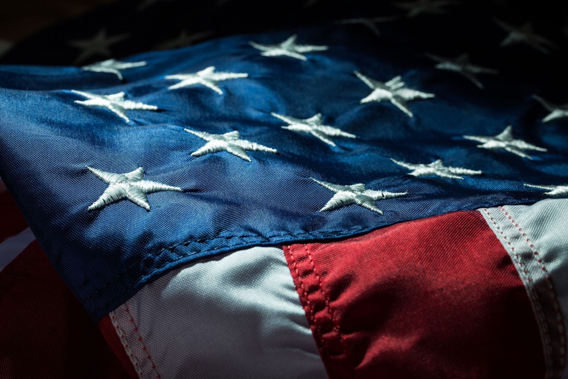 A close up of an american flag with stars on it.