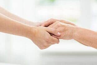 Holding Hands of Senior and Staff — Home Care in Swarthmore, PA