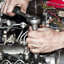 Man Fixing A Broken Car — Kingsley, MI  — BC Transmission