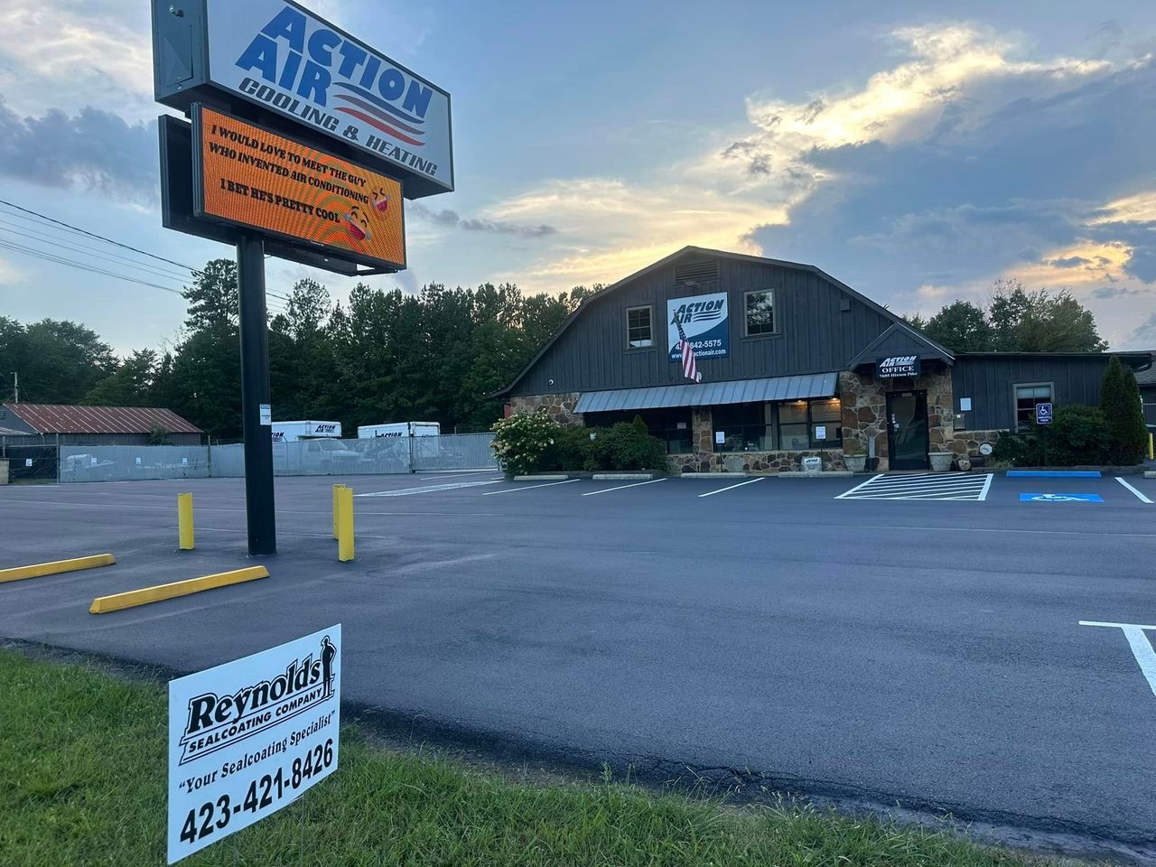 A large building with a sign in front of it that says action air.
