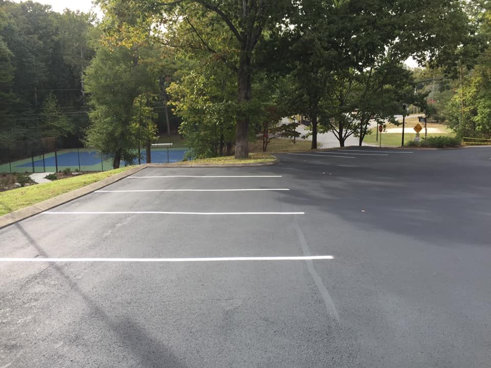 Freshly paved parking lot with new parking lines.