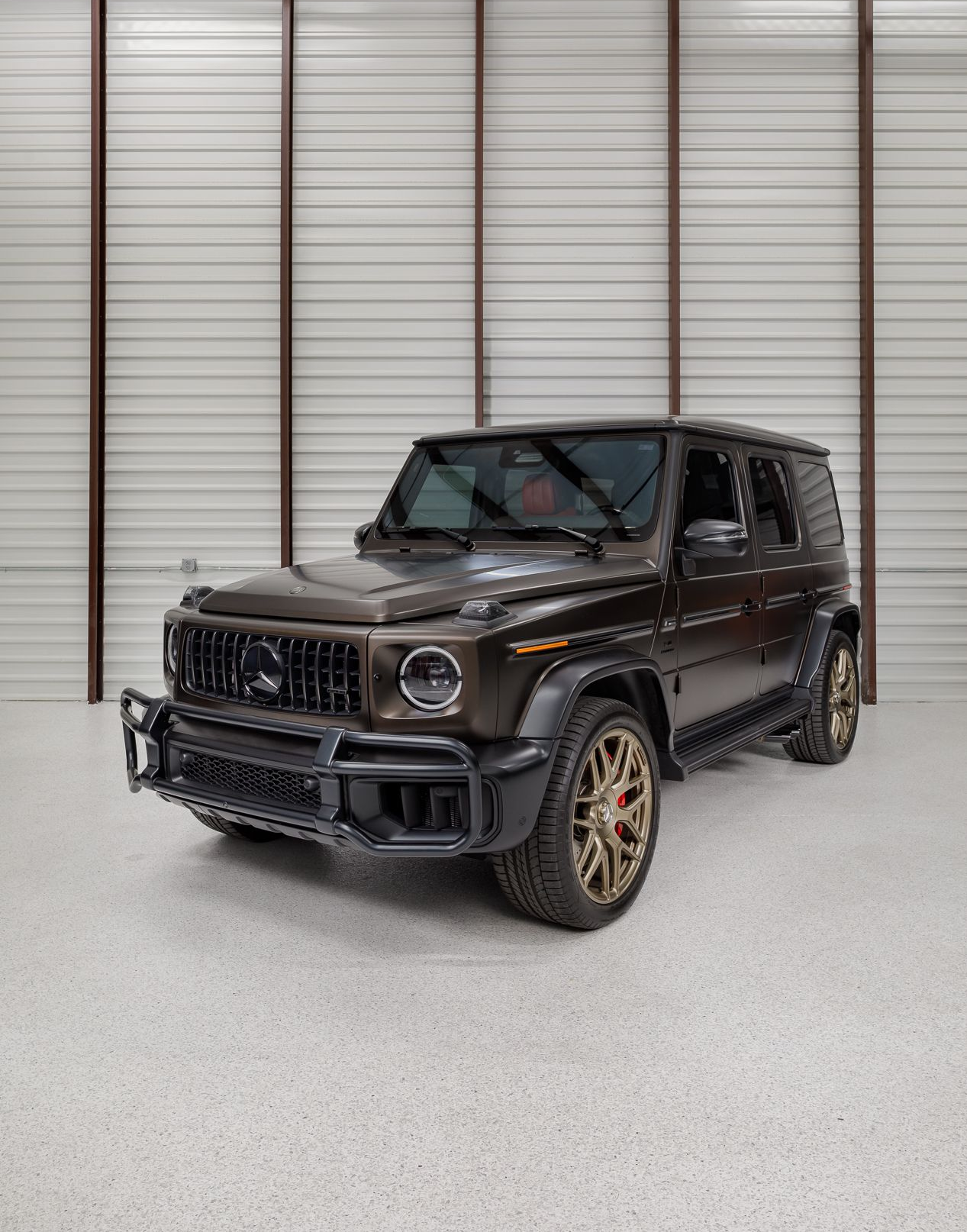 Black Mercedes SUV in garage