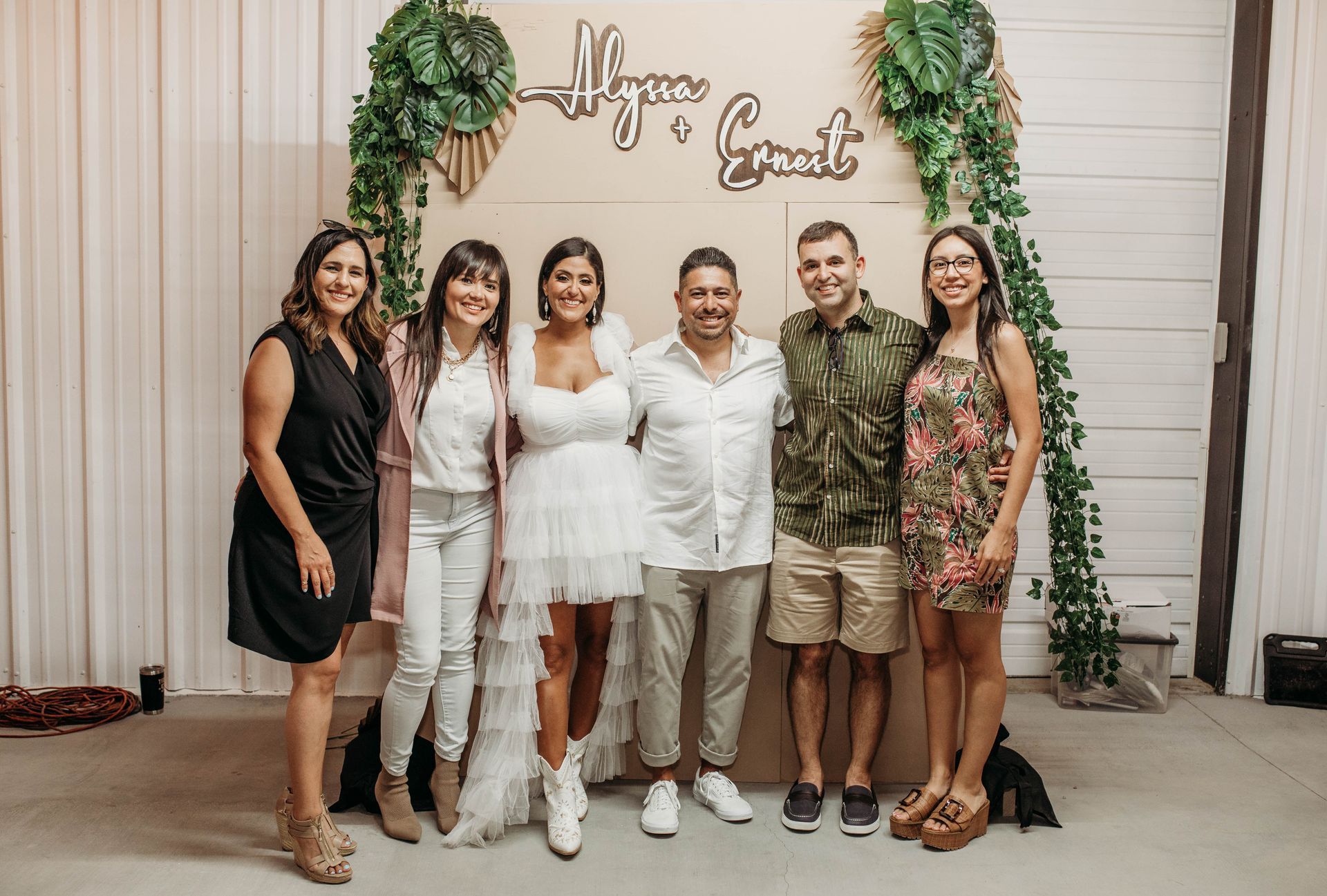 Group of friends standing and smiling for a picture at an Austin event