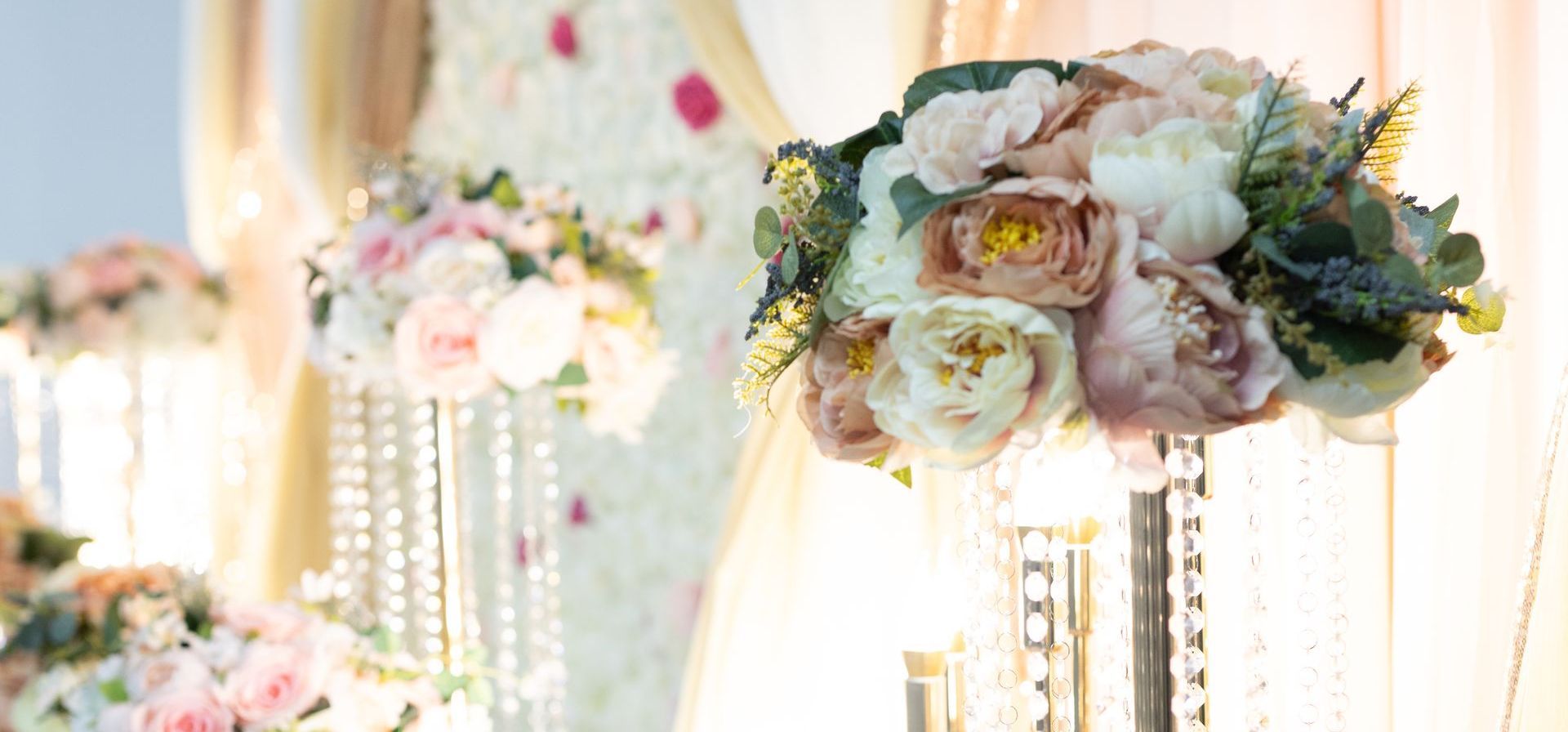 A wedding ceremony with flowers and candles
