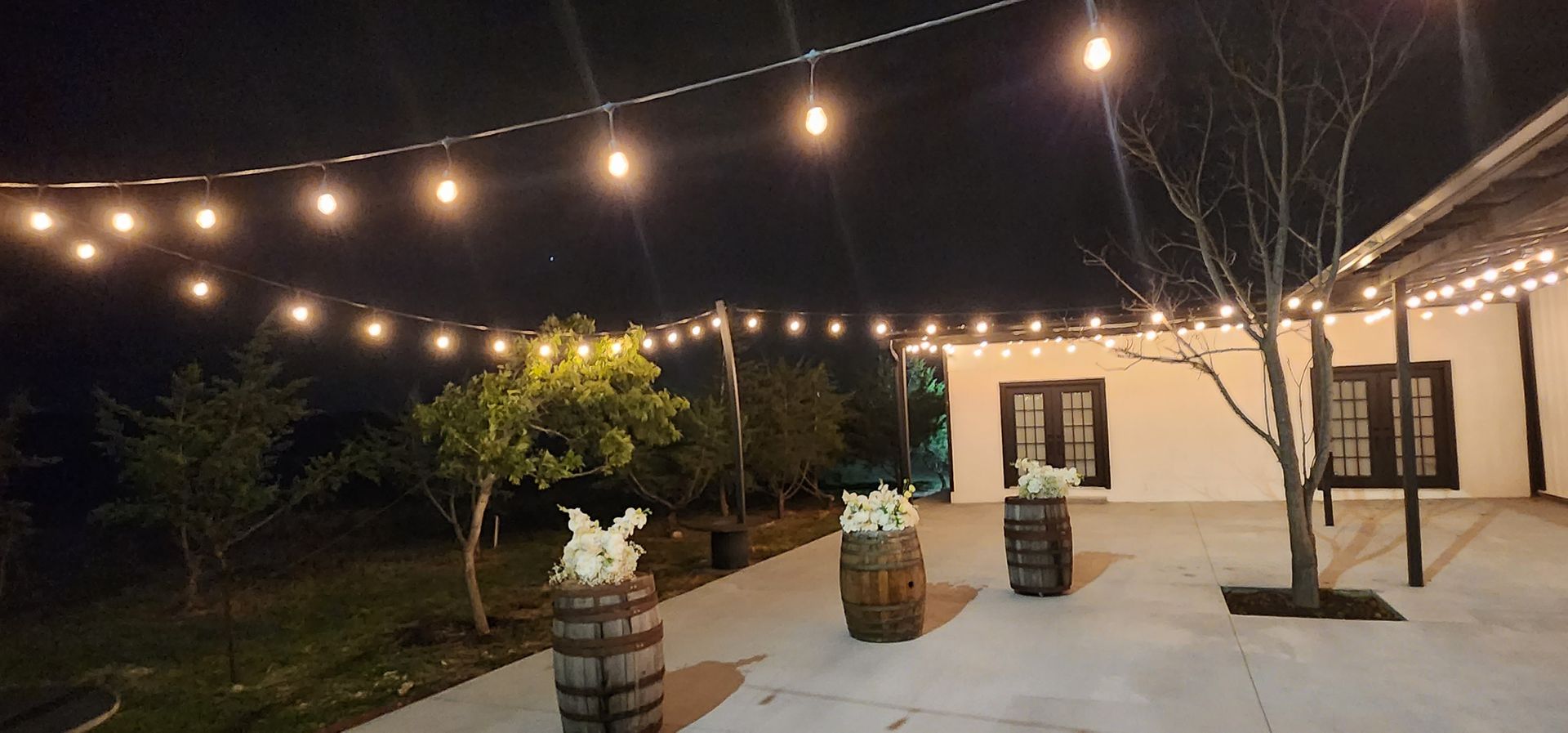 A couple of barrels placed on a patio at an event venue in Austin, Texas