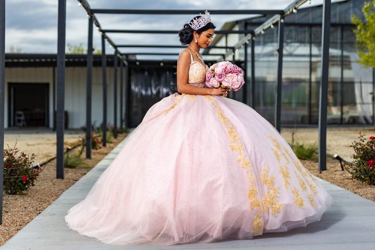 A quinceanera celebrant in Austin wearing pink gown 