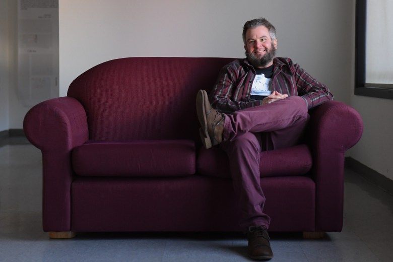Alex Edwards sits for a portrait during the Community Supported Shelters arts entrepreneurship program graduation in Eugene, Oct. 21, 2025. Credit: Isaac Wasserman / Lookout Eugene-Springfield / Catchlight / RFA