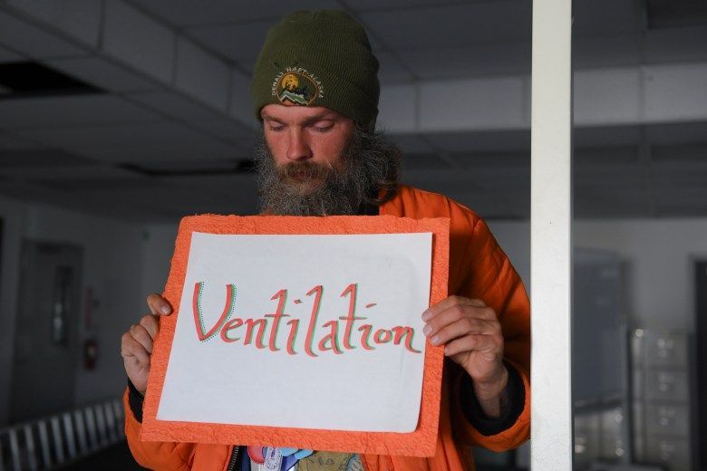 Liam O’Grady stands for a portrait during the Community Supported Shelters arts entrepreneurship program graduation in Eugene, Oct. 21, 2025. Credit: Isaac Wasserman / Lookout Eugene-Springfield / Catchlight / RFA