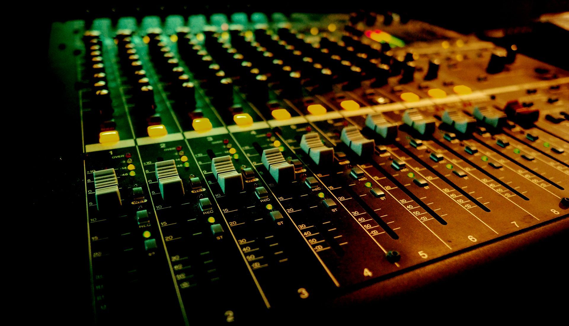 A close up of a mixer with a green light behind it