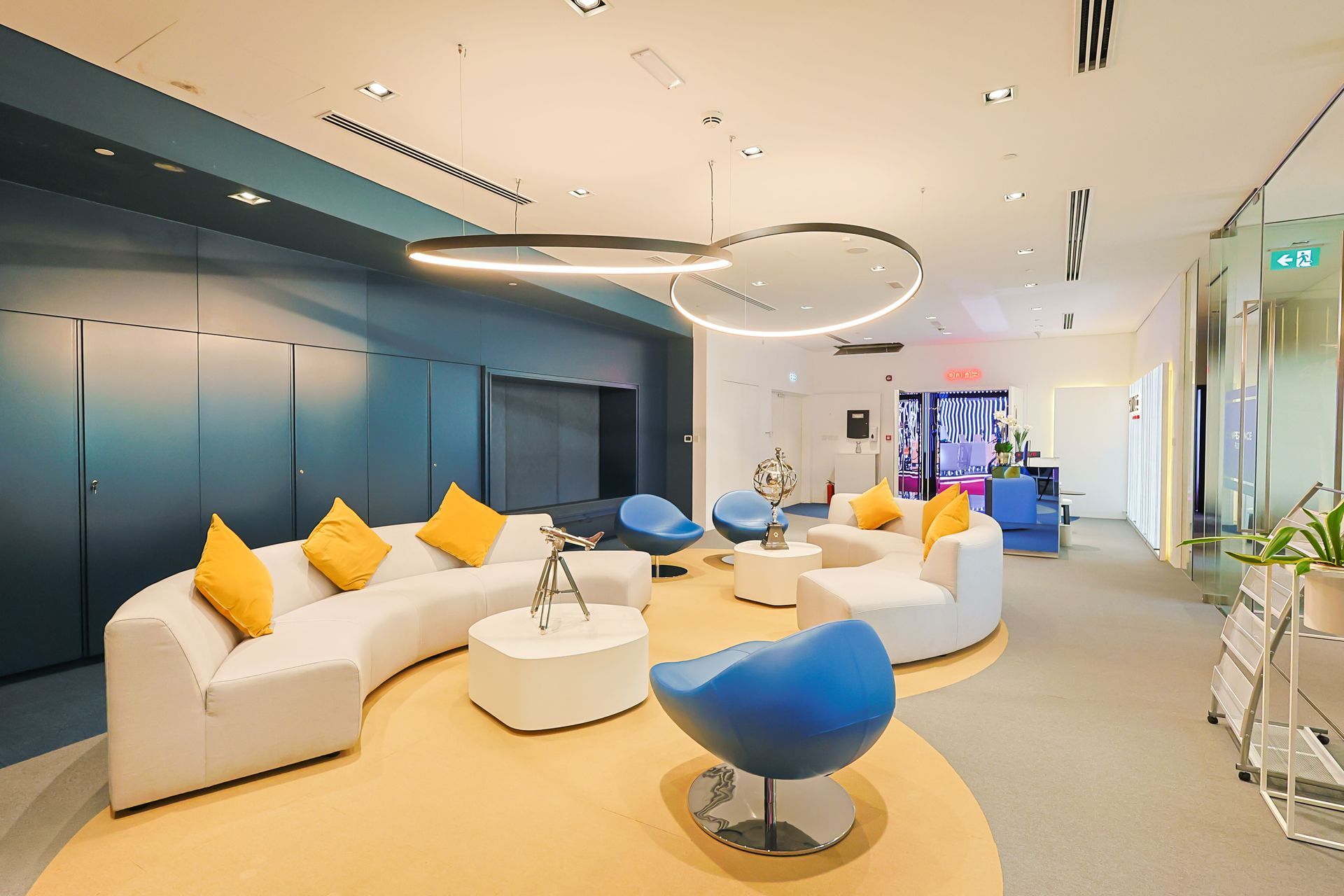 A living room with a couch , chairs , and a table.