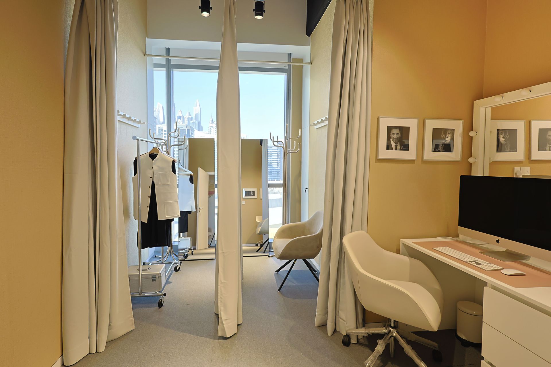 A room with a desk and chairs in it