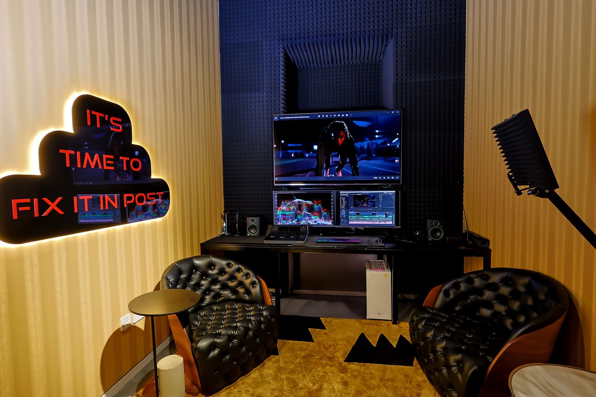 A room with two chairs and a sign that says it 's time to fix it in post