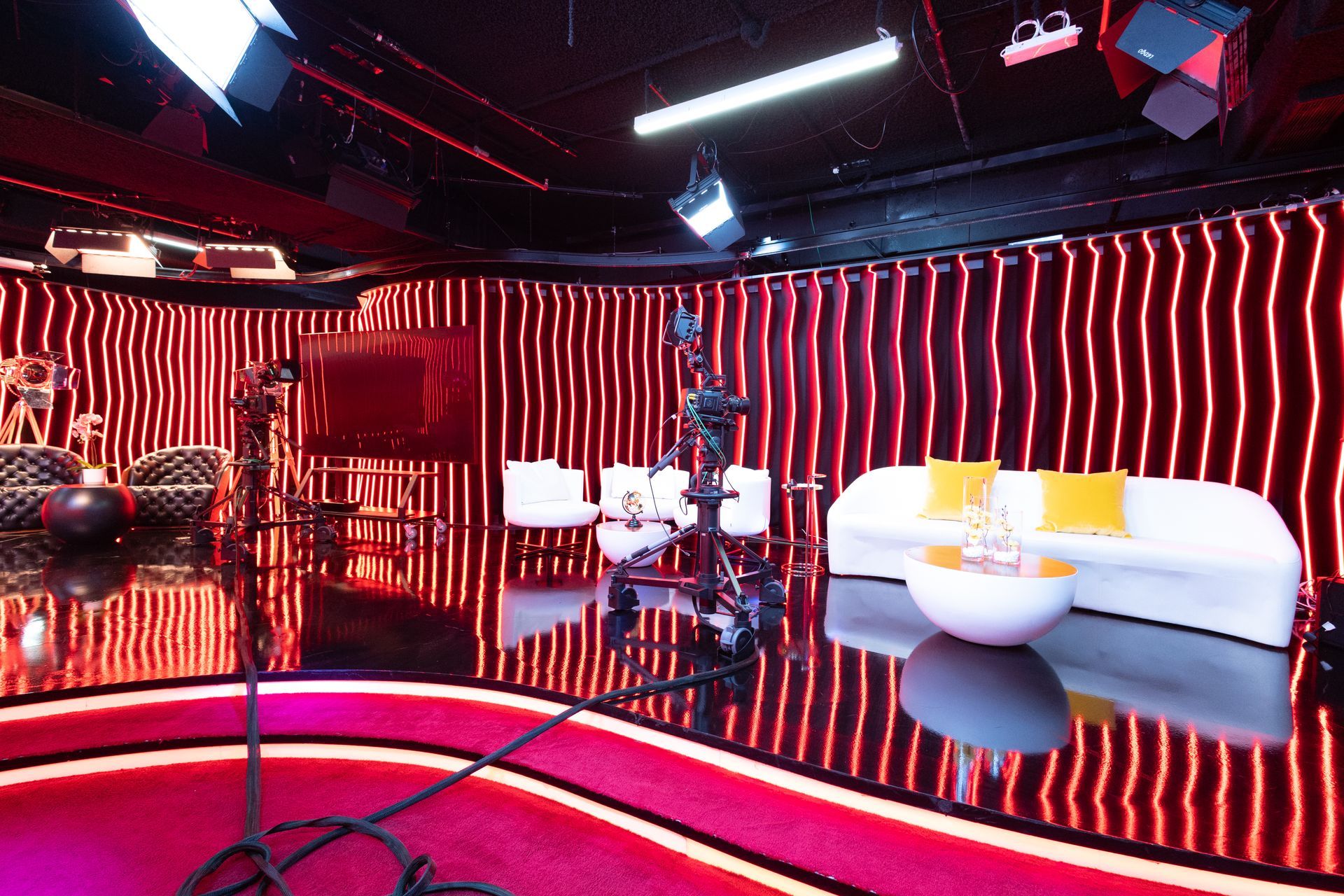 A room with a couch and chairs in it