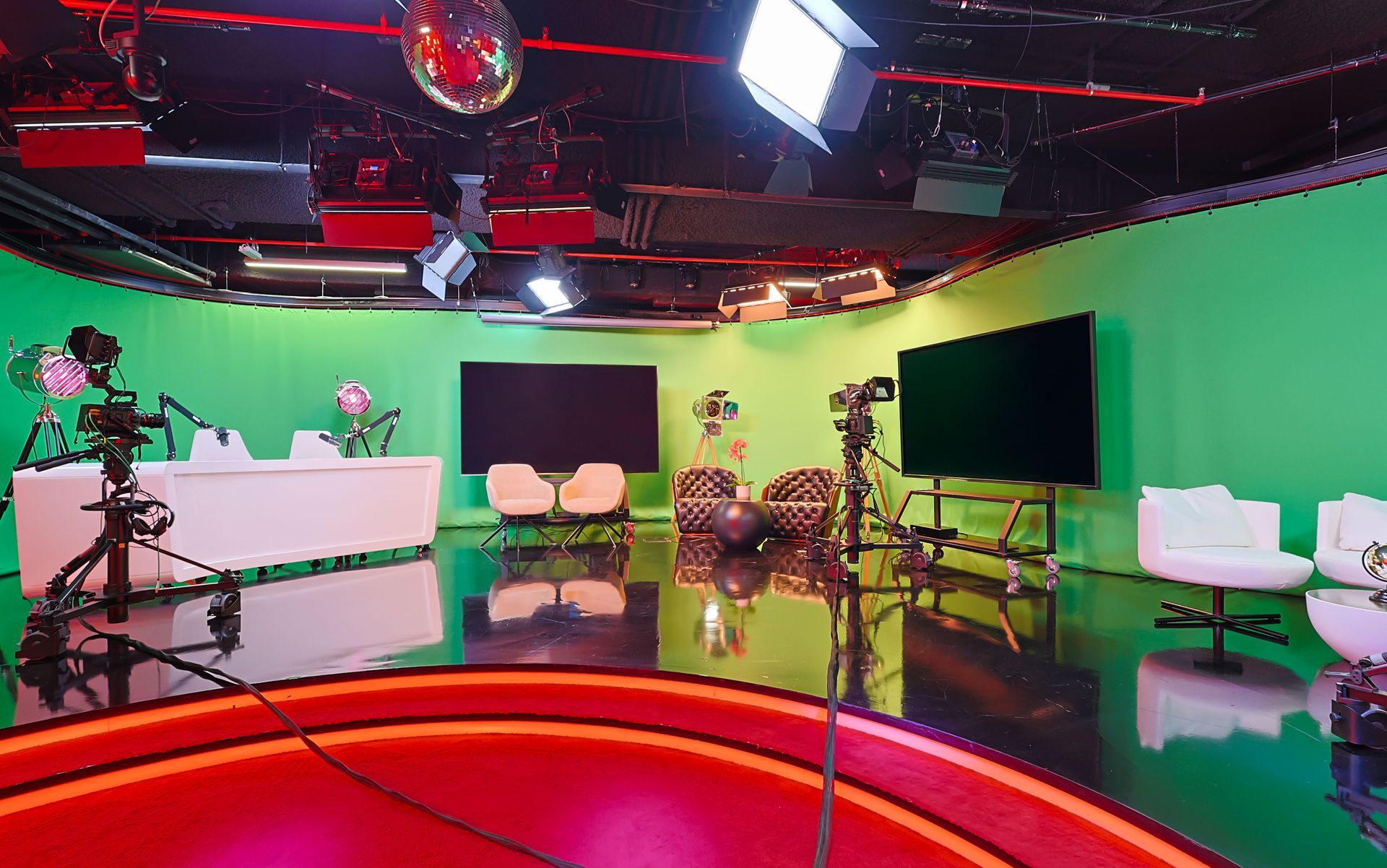 There is a green screen in the middle of the room.