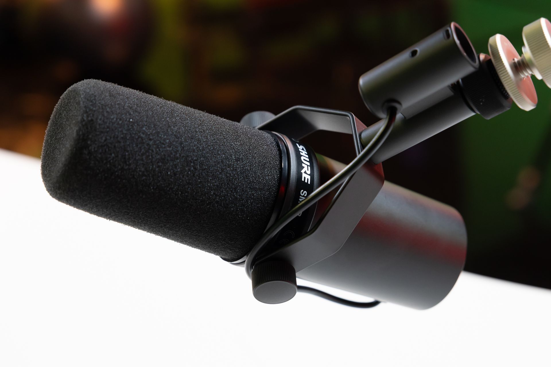A close up of a shure microphone on a table