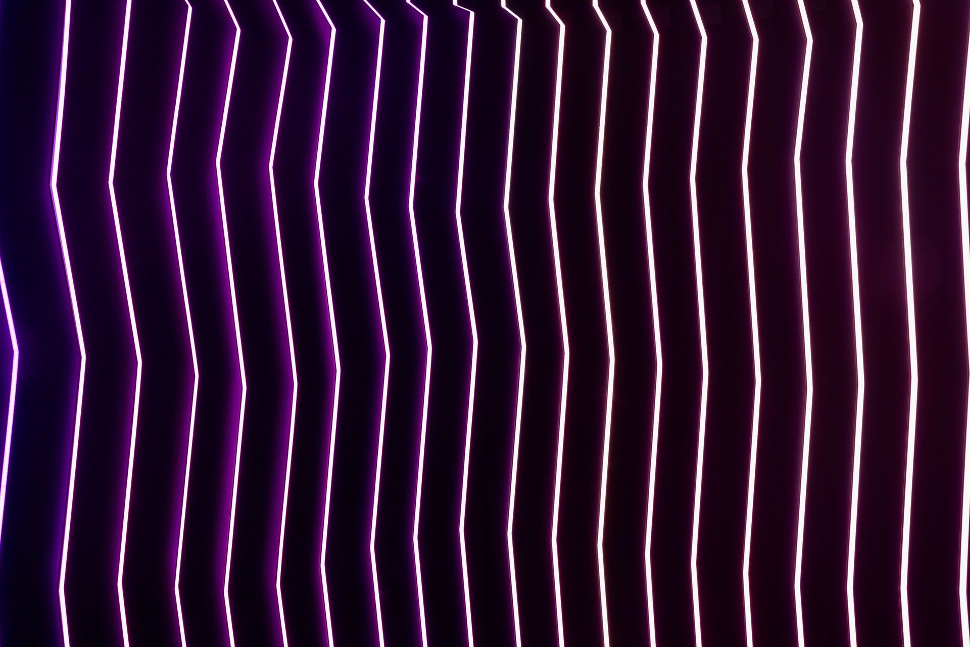 A close up of a purple and white striped background