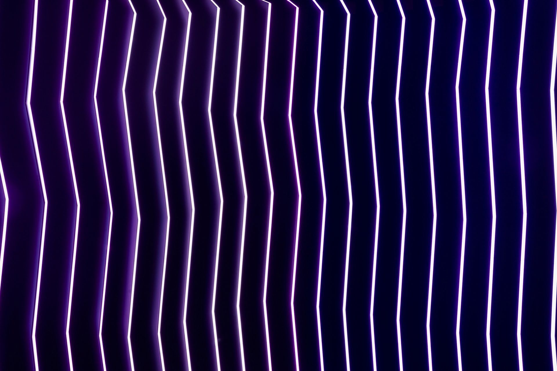 A close up of a purple and white striped background