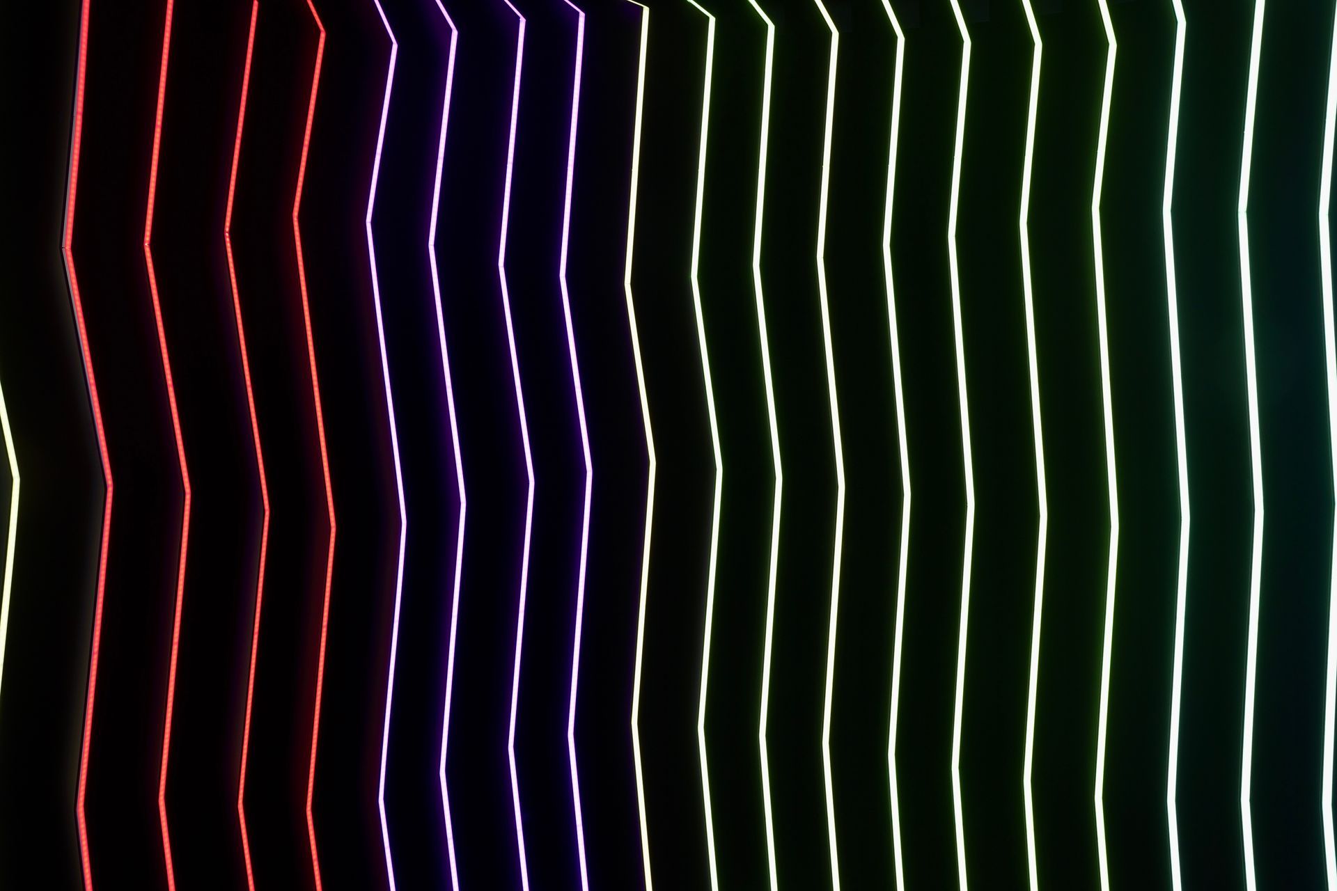 A bunch of colorful lines on a black background