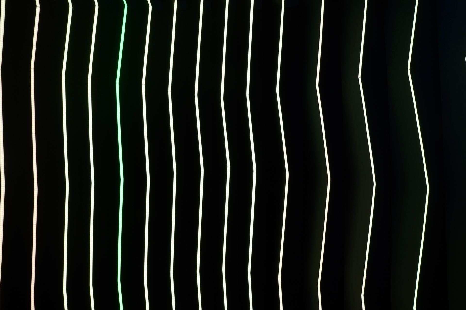 A row of white lines on a black background.