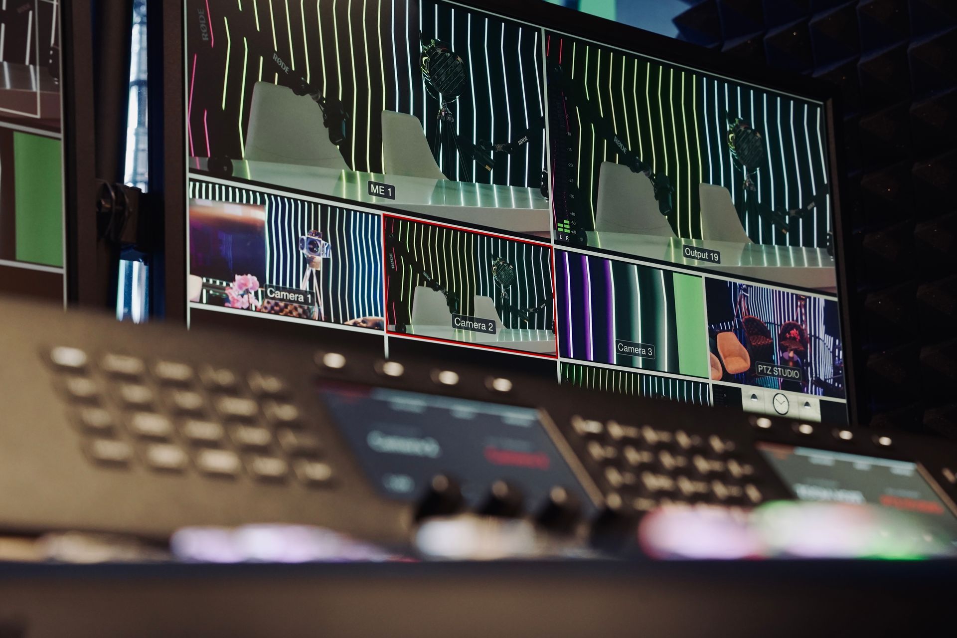 A close up of a control panel with a bunch of screens on it.