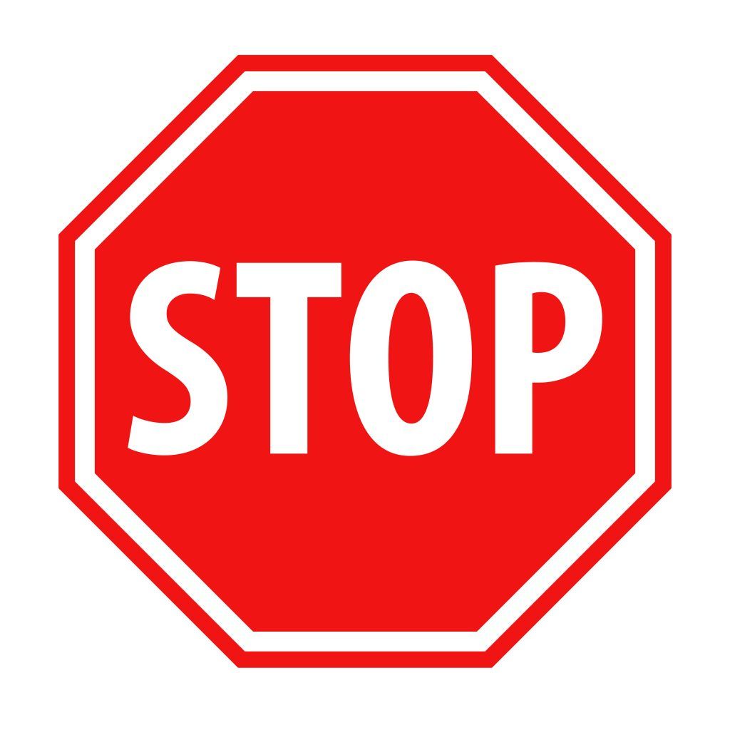 A red stop sign with white letters on a white background