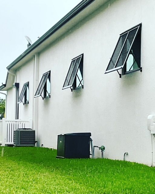 A white building with a lot of windows on it