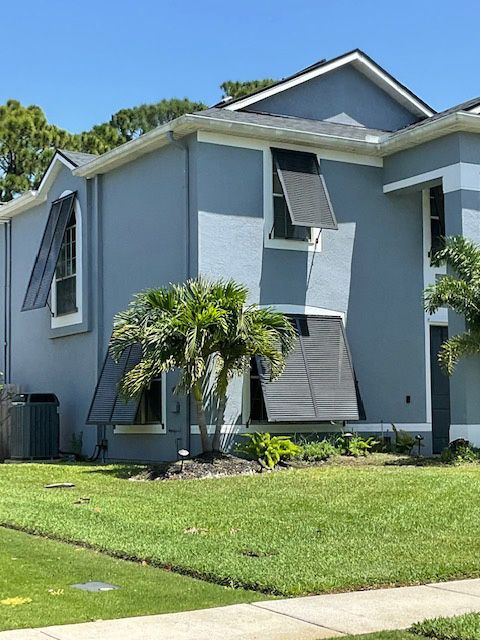 A house with a palm tree in front of it