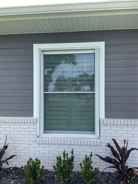 There is a window on the side of a house