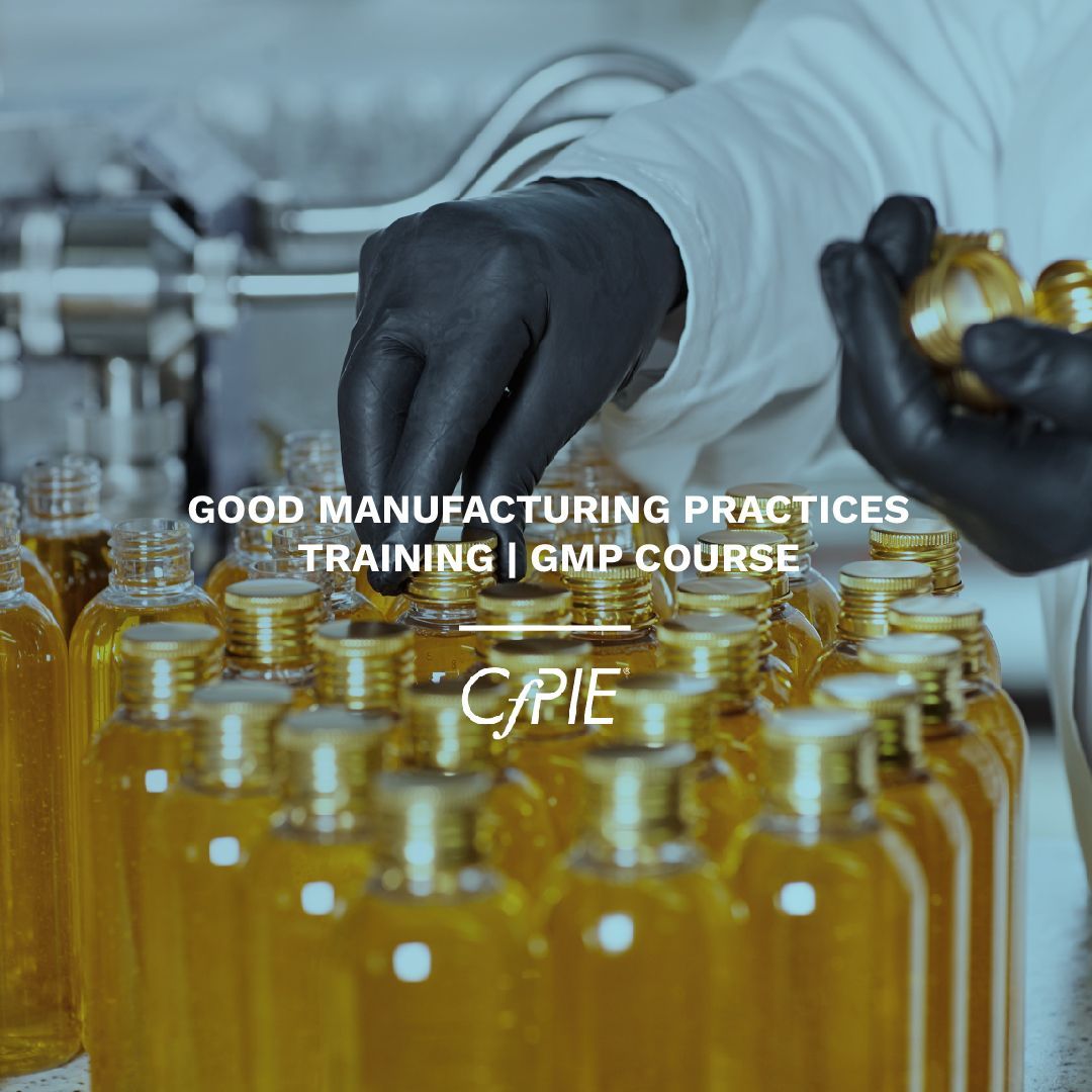 A person wearing black gloves is holding a bottle in their hands ..