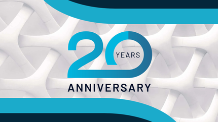 A blue and white logo with the words `` 20 years anniversary '' on a white background.