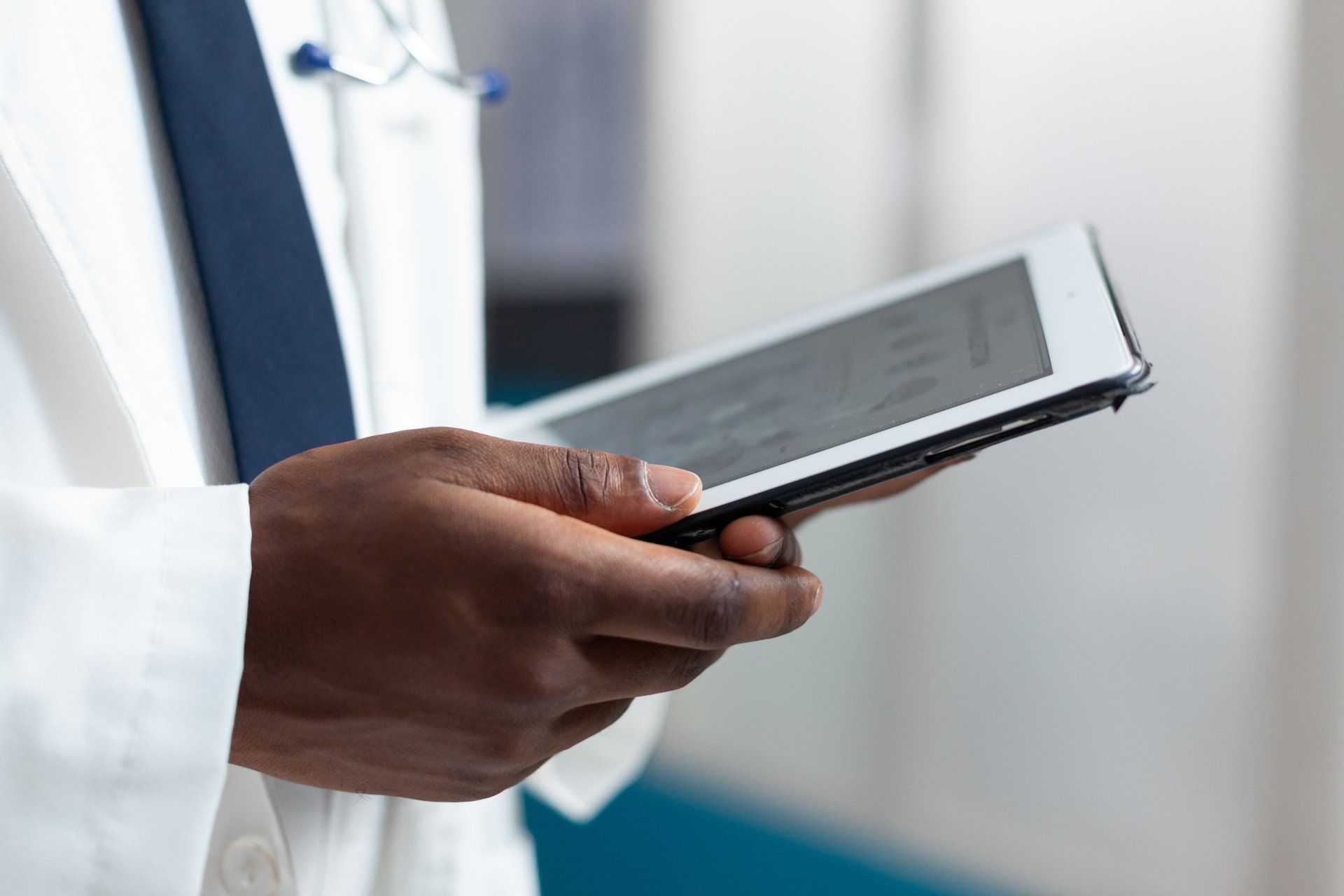 medical professional holding a tablet device