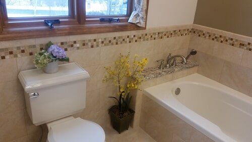 Residential Repair Service — Bathroom With Flowers in Lewisville, TX