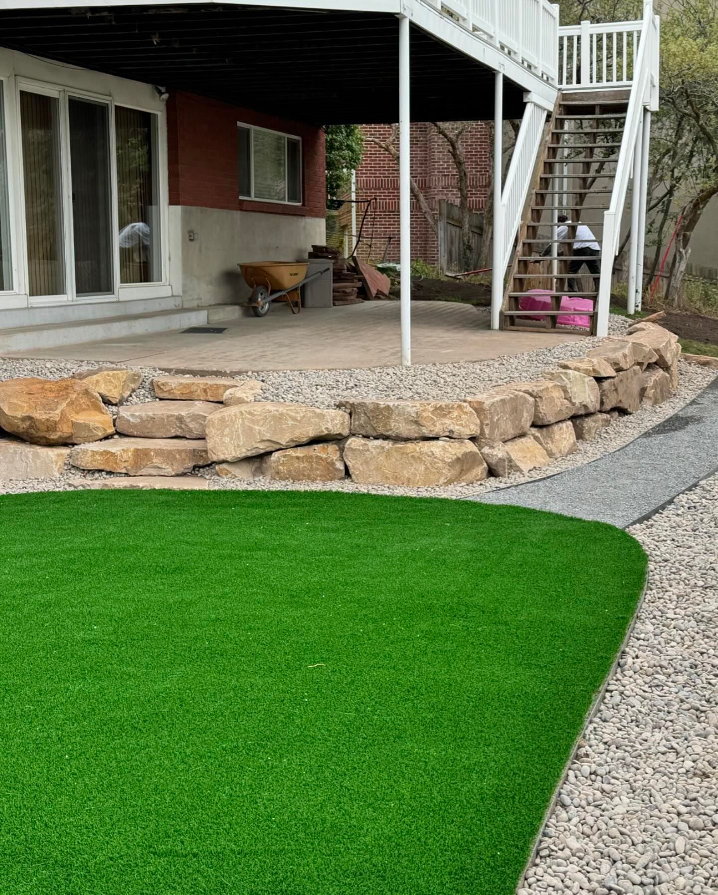 A house with a patio and stairs in the backyard.