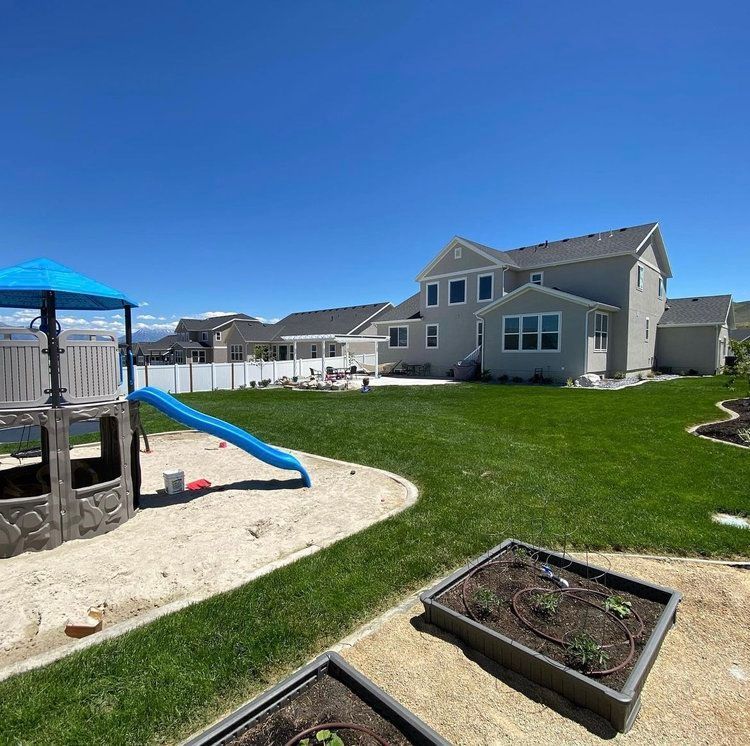 A house with a playground in front of it